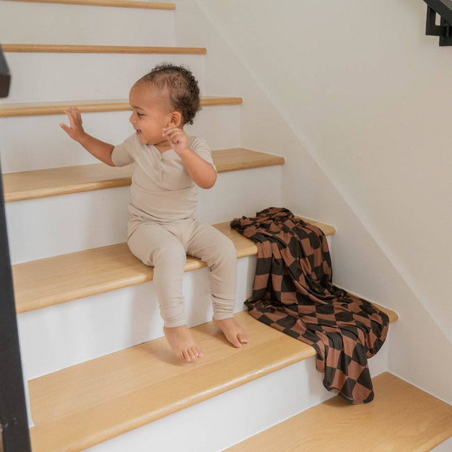 Ink & Earth Checkerboard Stretch Swaddle Blanket